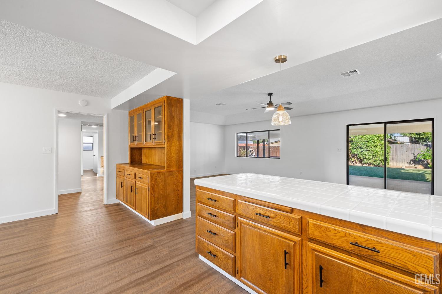 Undisclosed Address Bakersfield, CA 93314 - Photo 31 of 60 a spacious bathroom with a granite countertop sink a mirror and a bath tub