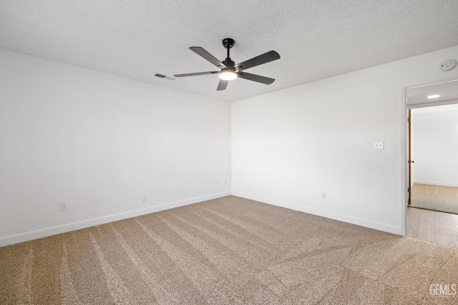 Undisclosed Address Bakersfield, CA 93314 - Photo 35 of 60 a view of a big room with carpet