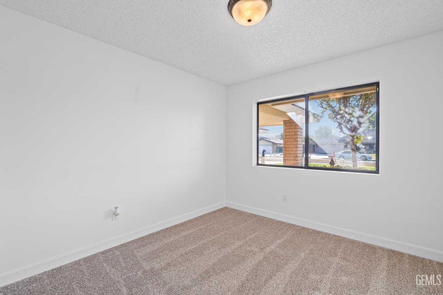 Undisclosed Address Bakersfield, CA 93314 - Photo 47 of 60 an empty room with a window
