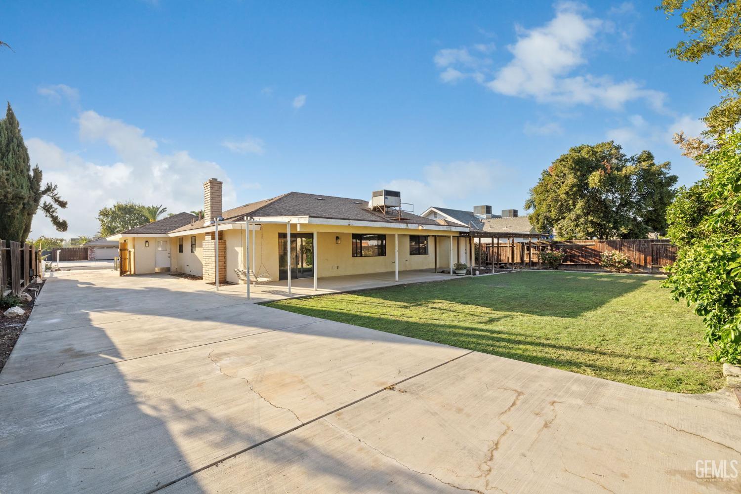 Undisclosed Address Bakersfield, CA 93314 - Photo 49 of 60 a front view of a house with a yard
