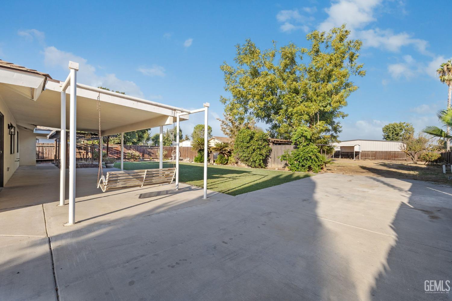 Undisclosed Address Bakersfield, CA 93314 - Photo 50 of 60 a view of a garden with an outdoor space