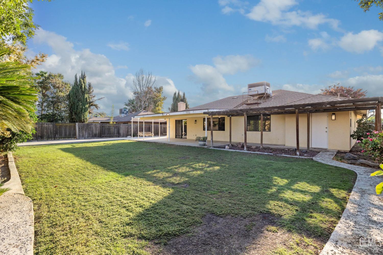 Undisclosed Address Bakersfield, CA 93314 - Photo 51 of 60 a view of a house with a swimming pool
