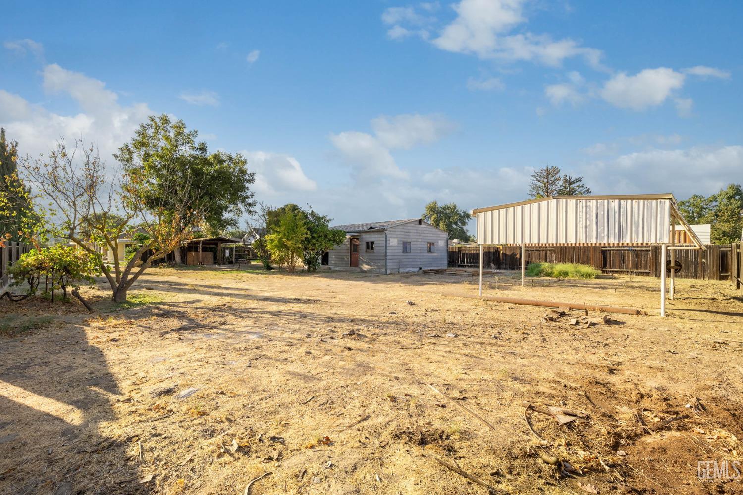 Undisclosed Address Bakersfield, CA 93314 - Photo 57 of 60 a swimming pool with a yard