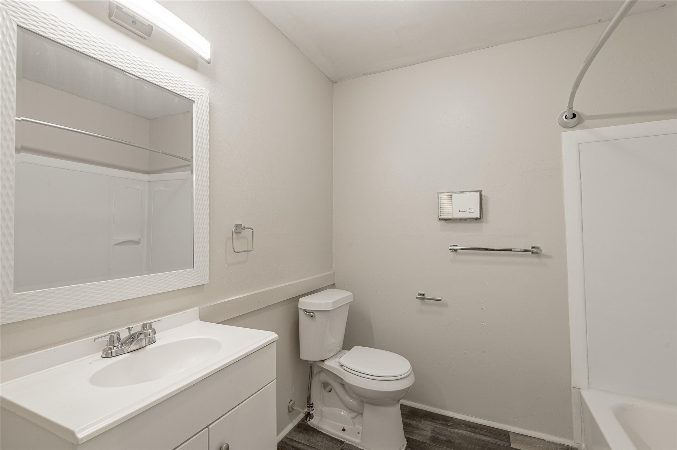 818 University Avenue, Unit 8 Huntsville, TX 77320 - Photo 13 of 22 a bathroom with a sink toilet and a mirror