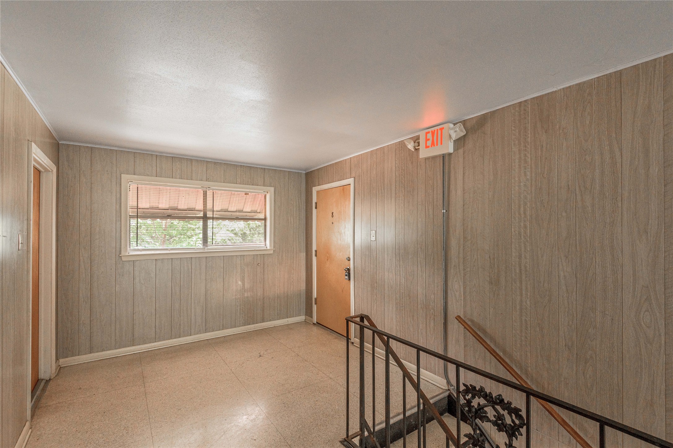 818 University Avenue, Unit 8 Huntsville, TX 77320 - Photo 18 of 22 a view of an empty room with wooden floor