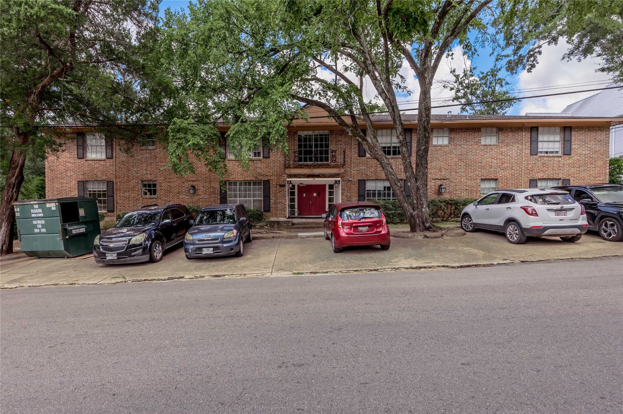 818 University Avenue, Unit 8 Huntsville, TX 77320 - Photo 19 of 22 a car parked in front of a house