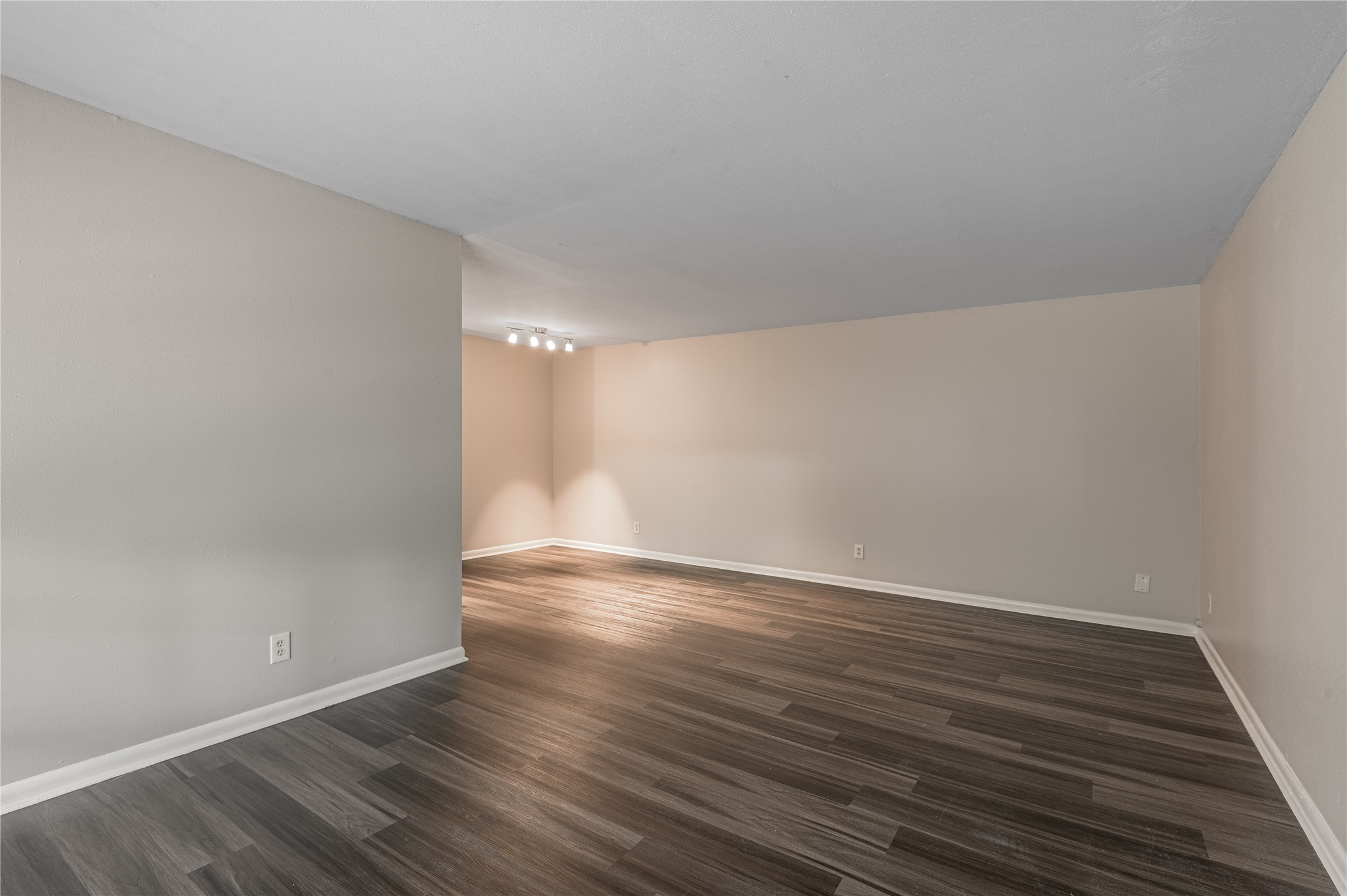 818 University Avenue, Unit 8 Huntsville, TX 77320 - Photo 2 of 22 a view of an empty room with wooden floor