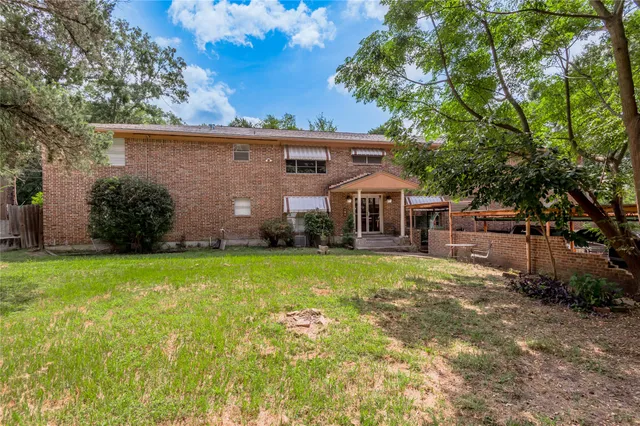 front view of a house with a big yard