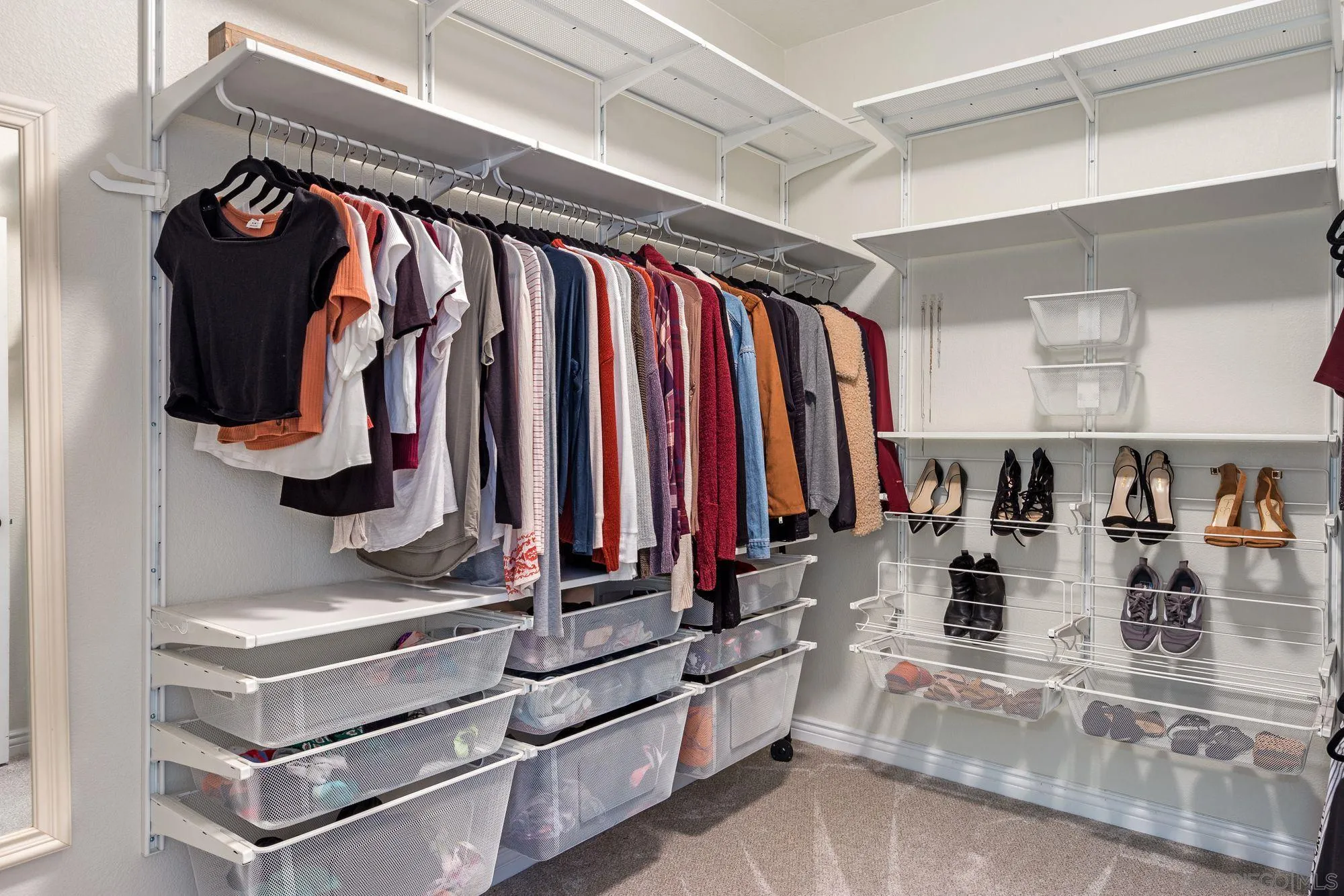 3957 30th Street, Unit 411 San Diego, CA 92104 - Photo 11 of 23 a view of walk in closet with clothes and shoes