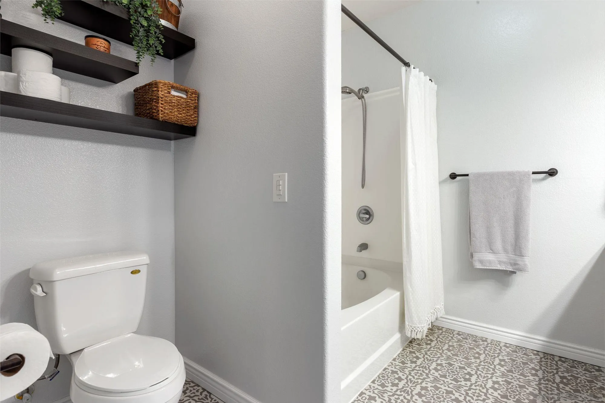 3957 30th Street, Unit 411 San Diego, CA 92104 - Photo 13 of 23 a bathroom with a toilet and a shower