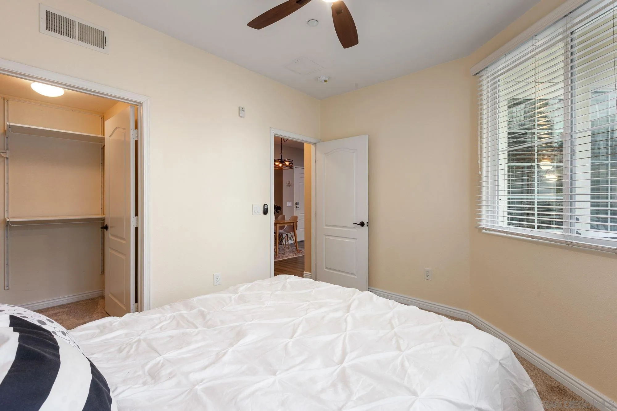 3957 30th Street, Unit 411 San Diego, CA 92104 - Photo 15 of 23 a bedroom with a bed and a window
