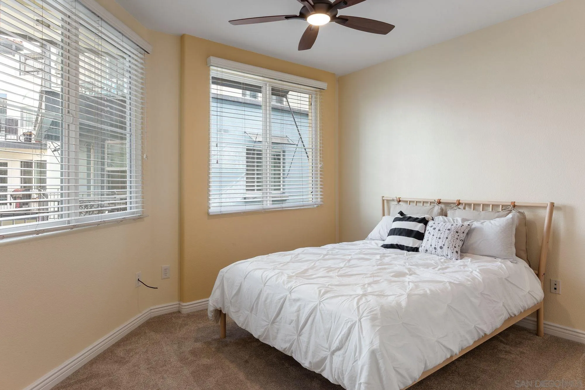 3957 30th Street, Unit 411 San Diego, CA 92104 - Photo 16 of 23 a bedroom with a bed and window