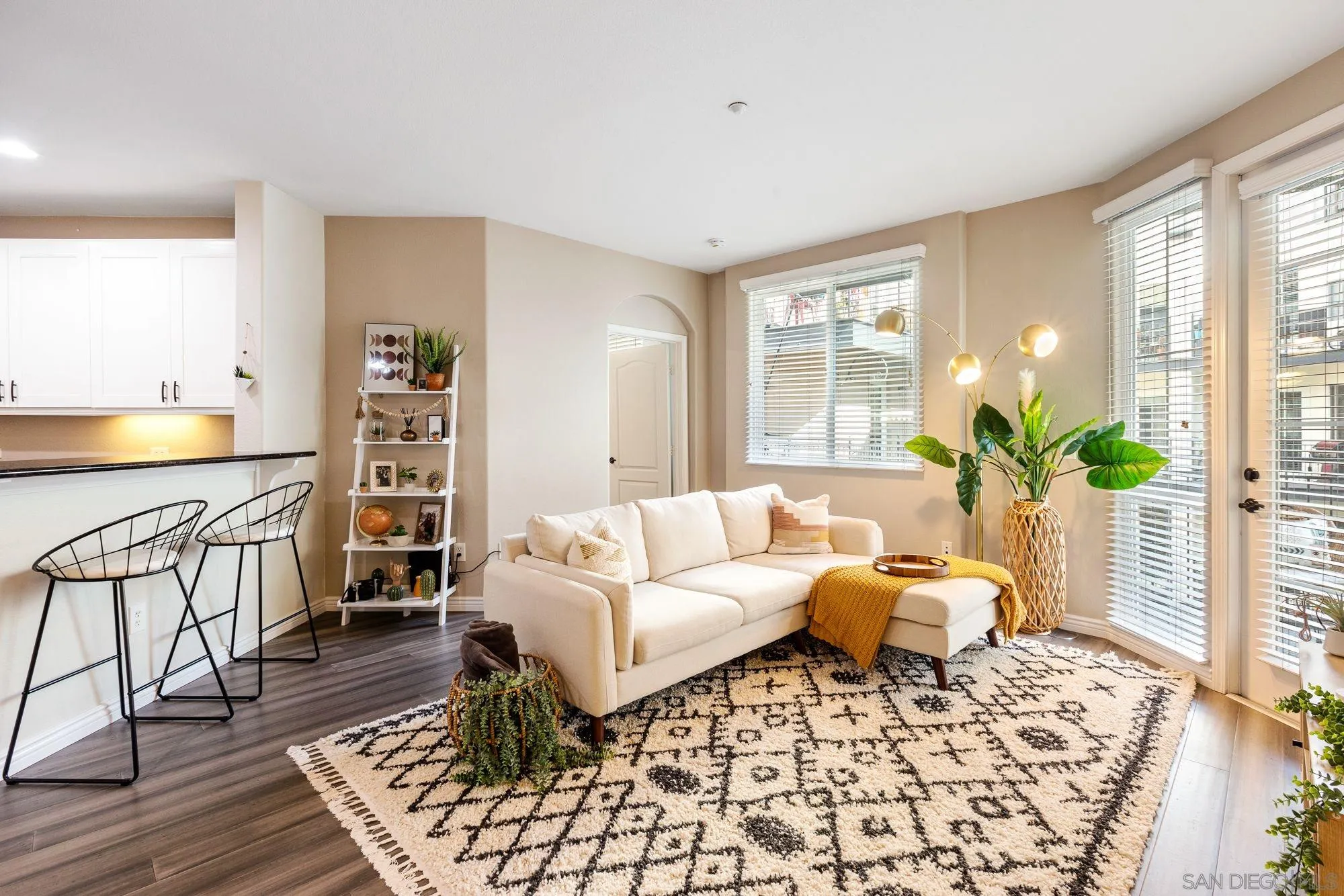 3957 30th Street, Unit 411 San Diego, CA 92104 - Photo 2 of 23 a living room with furniture and wooden floor