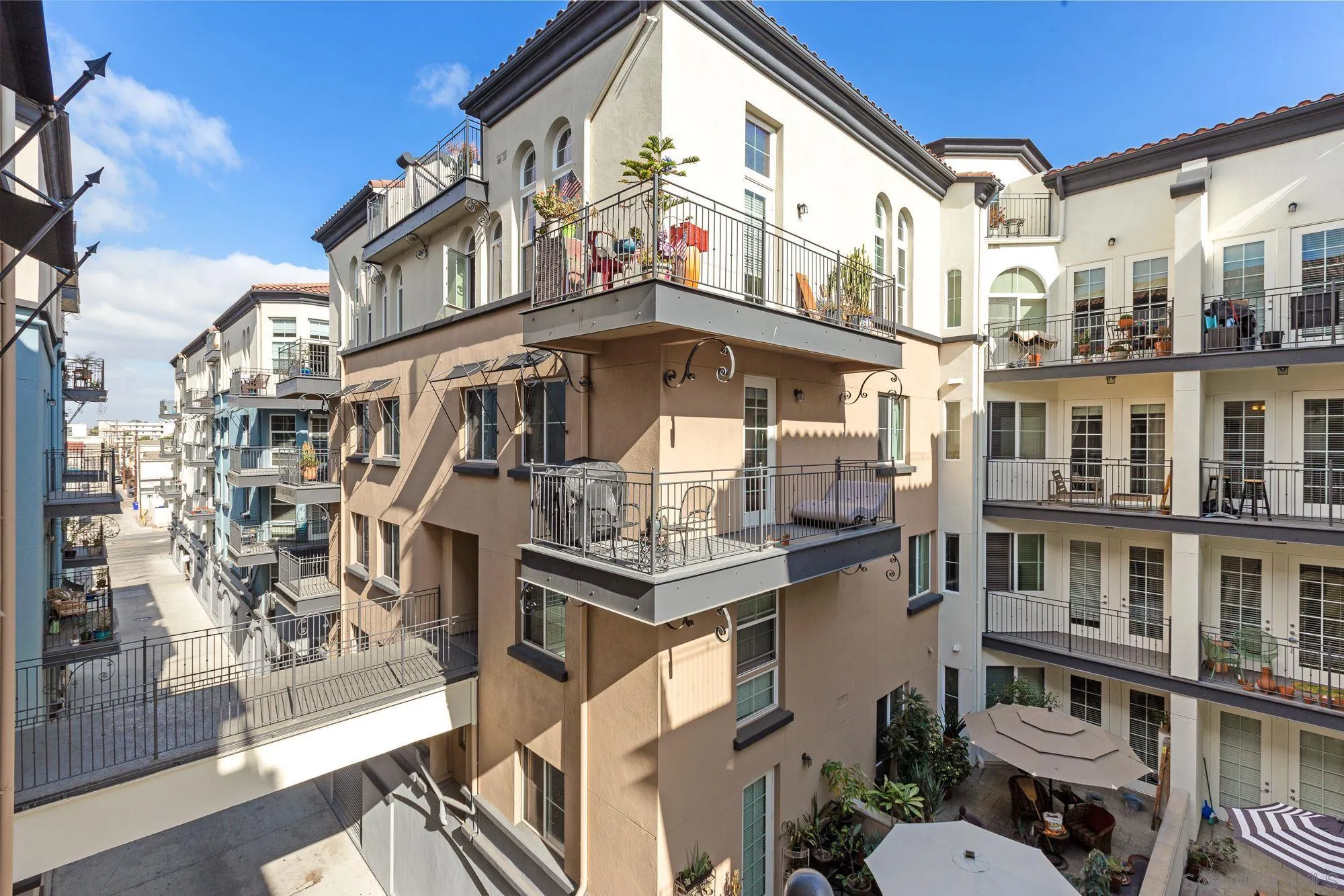 3957 30th Street, Unit 411 San Diego, CA 92104 - Photo 23 of 23 a view of a large building with a clock on the wall