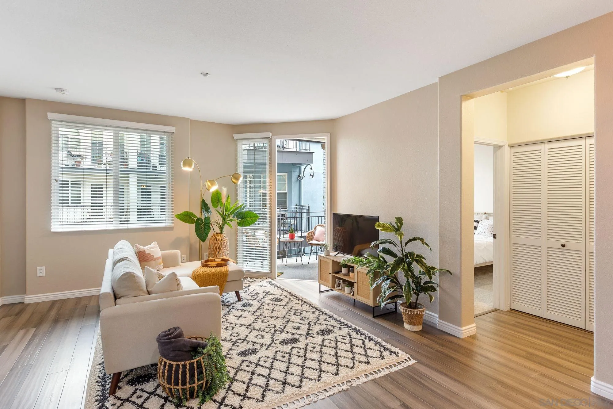 3957 30th Street, Unit 411 San Diego, CA 92104 - Photo 4 of 23 a living room with furniture and a window