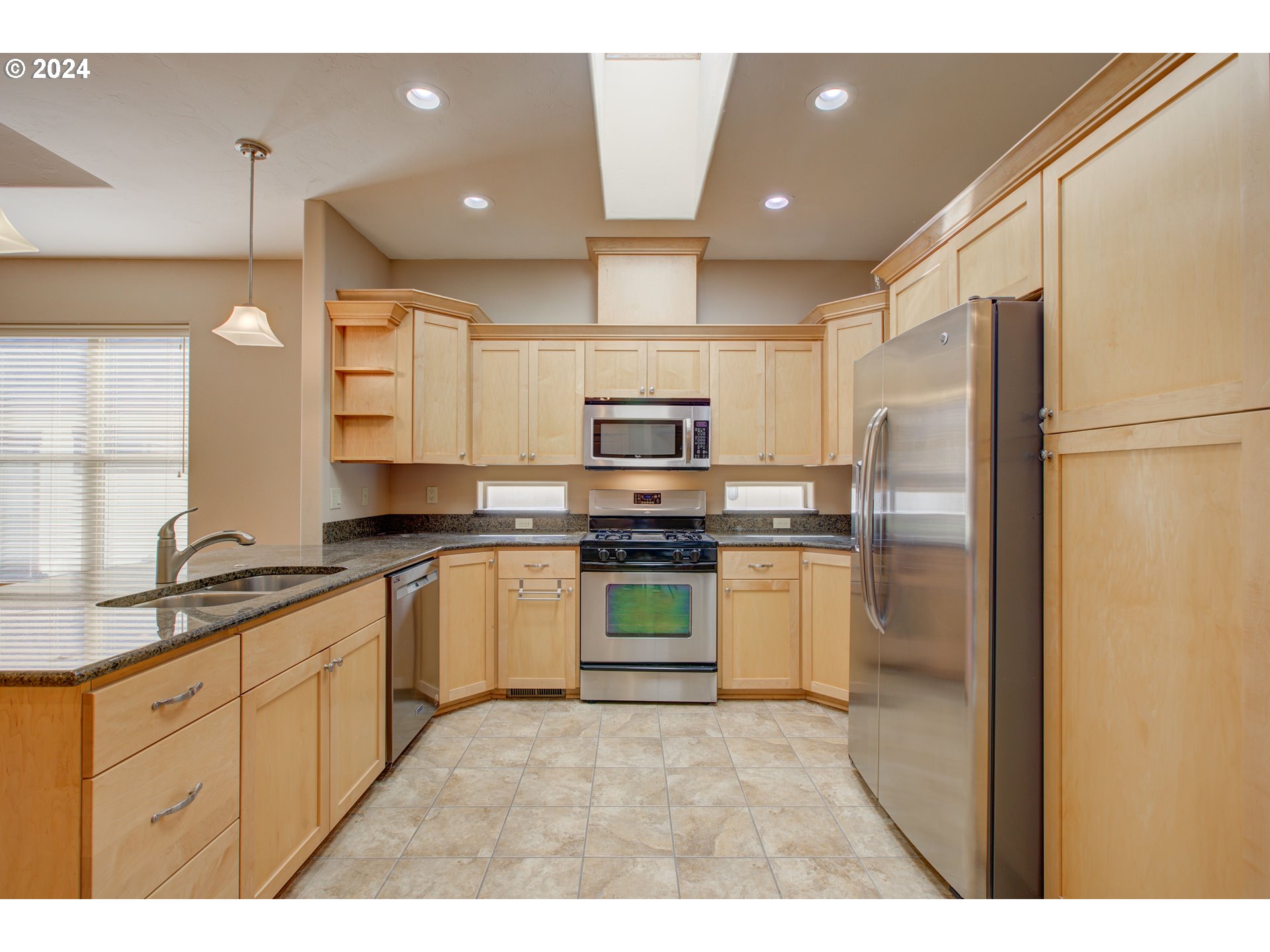 436 Backwater Loop Sutherlin, OR 97479 - Photo 14 of 46 a kitchen with stainless steel appliances granite countertop a refrigerator sink and stove