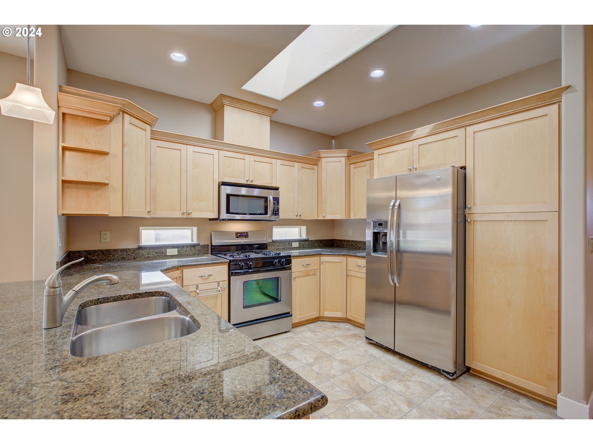 436 Backwater Loop Sutherlin, OR 97479 - Photo 16 of 46 a kitchen with stainless steel appliances granite countertop a refrigerator sink and stove