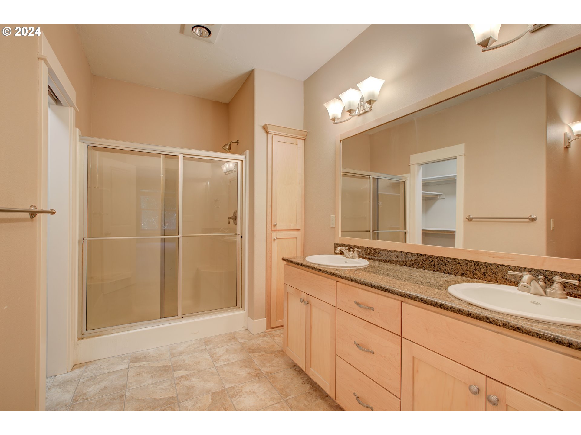 436 Backwater Loop Sutherlin, OR 97479 - Photo 26 of 46 a bathroom with a granite countertop sink a mirror and a shower