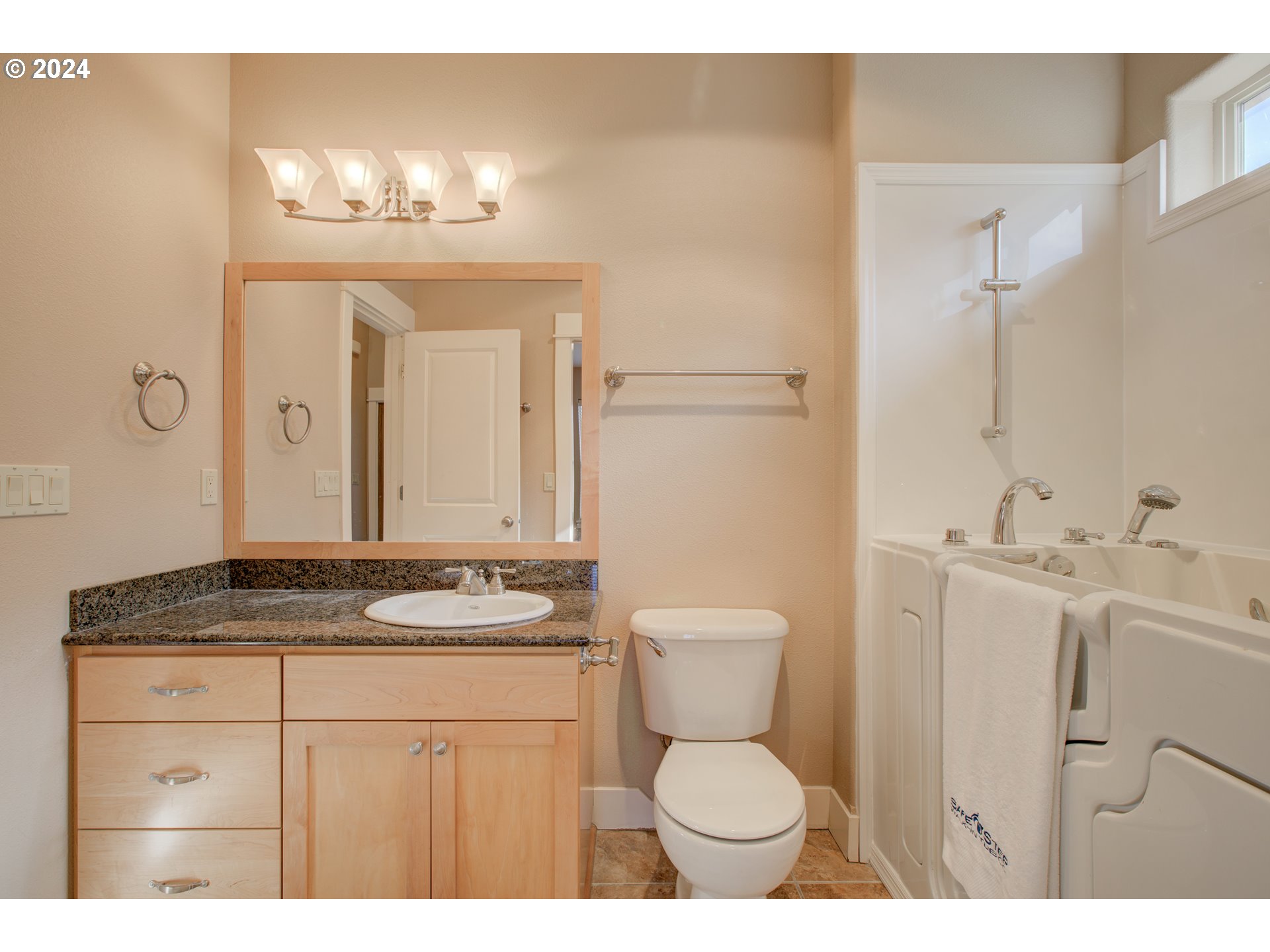 436 Backwater Loop Sutherlin, OR 97479 - Photo 32 of 46 a bathroom with a granite countertop sink toilet and mirror