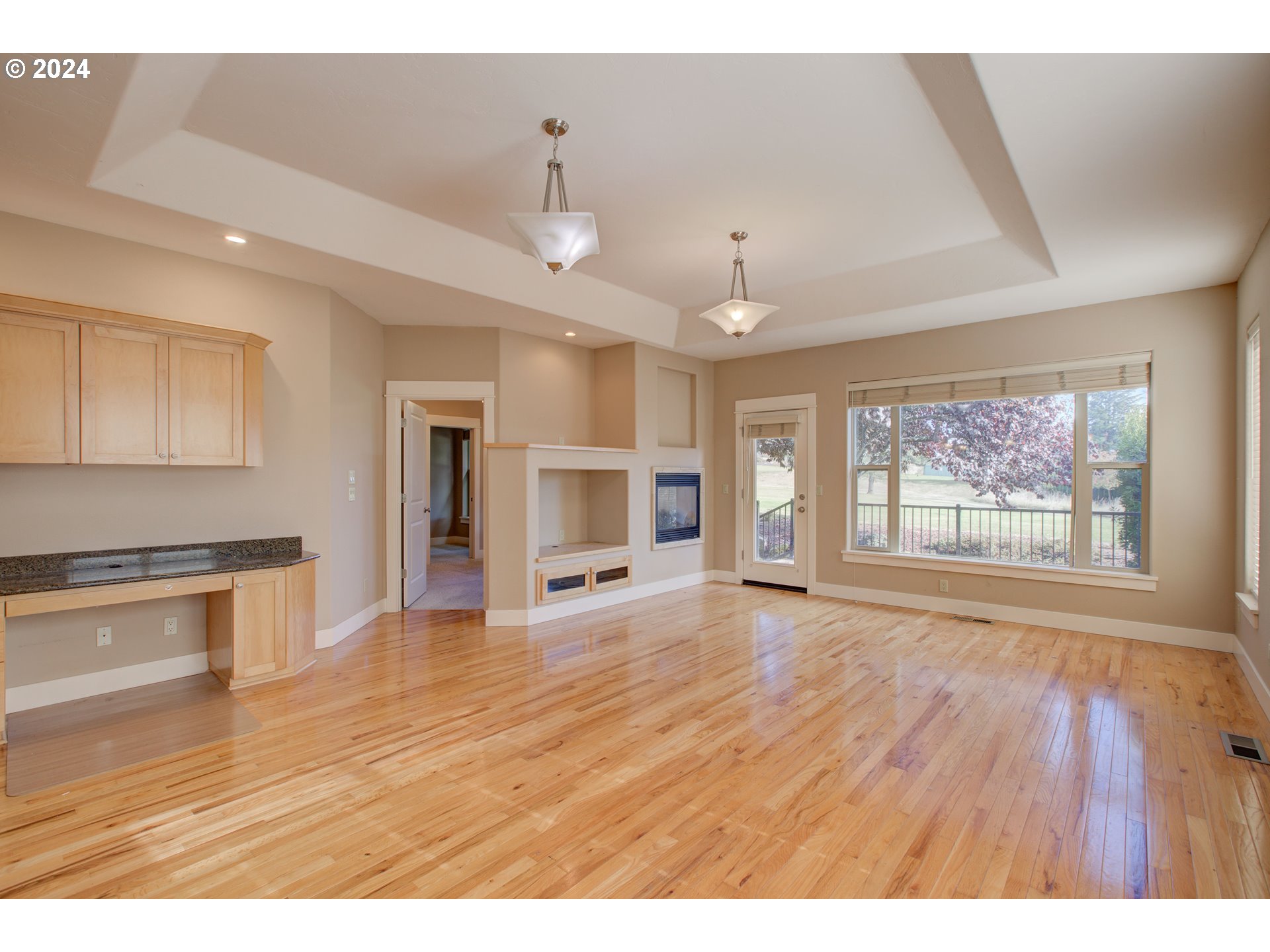 436 Backwater Loop Sutherlin, OR 97479 - Photo 7 of 46 a view of an empty room with window and wooden floor