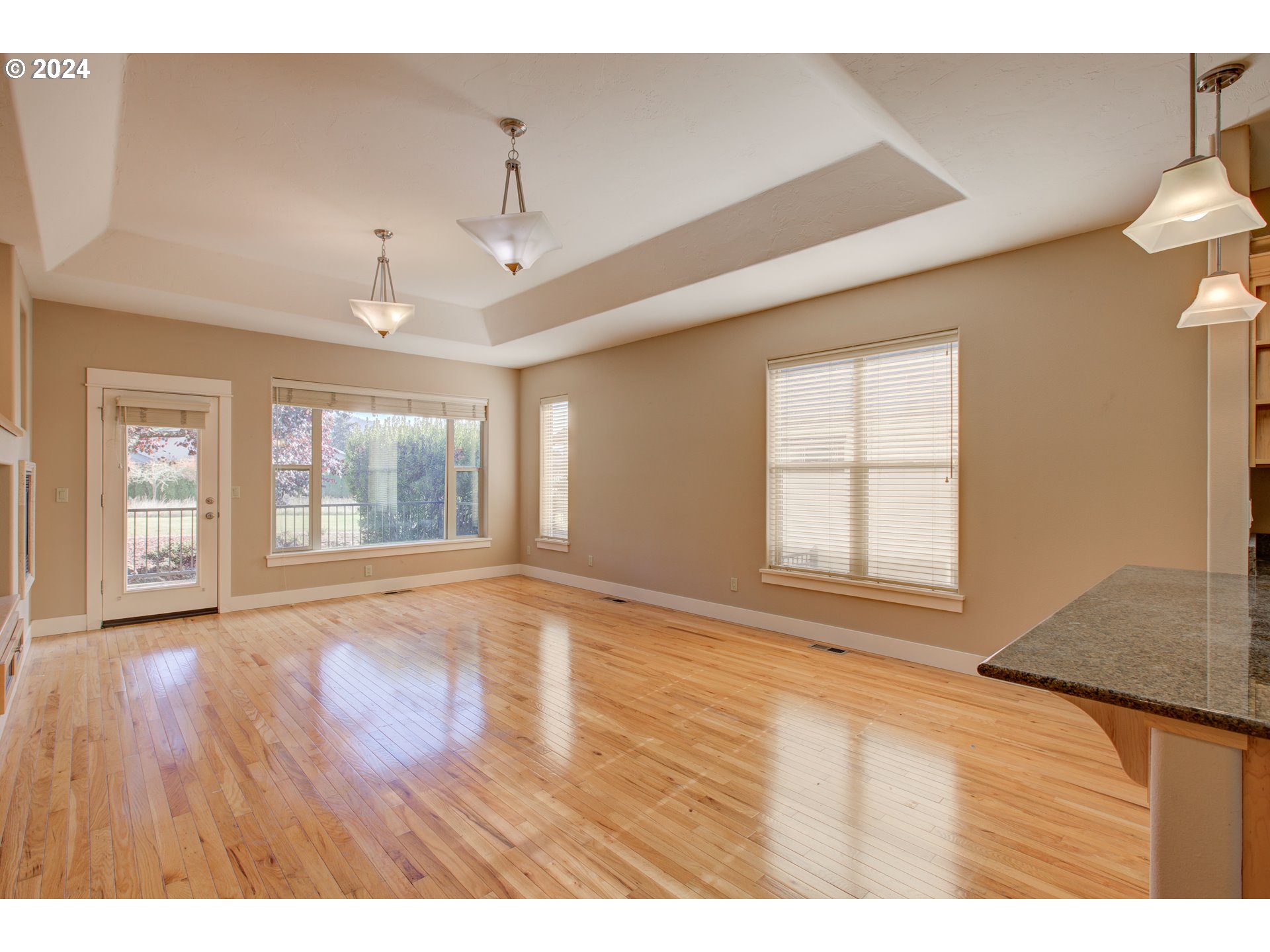 436 Backwater Loop Sutherlin, OR 97479 - Photo 8 of 46 a view of an empty room with wooden floor and a window