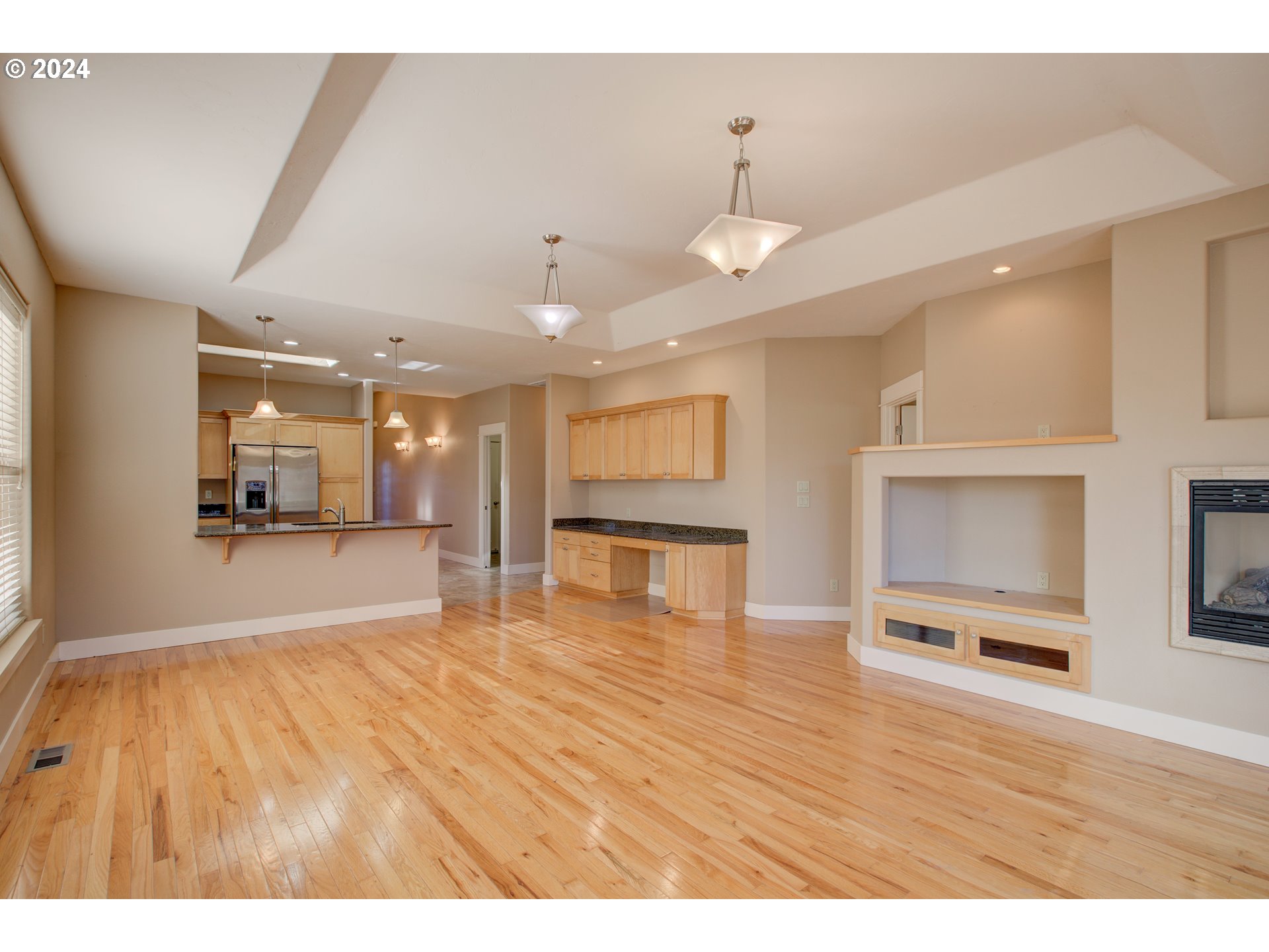 436 Backwater Loop Sutherlin, OR 97479 - Photo 10 of 46 a view of an empty room with kitchen view and a window