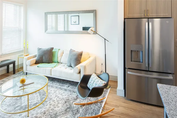 a living room with furniture and a window