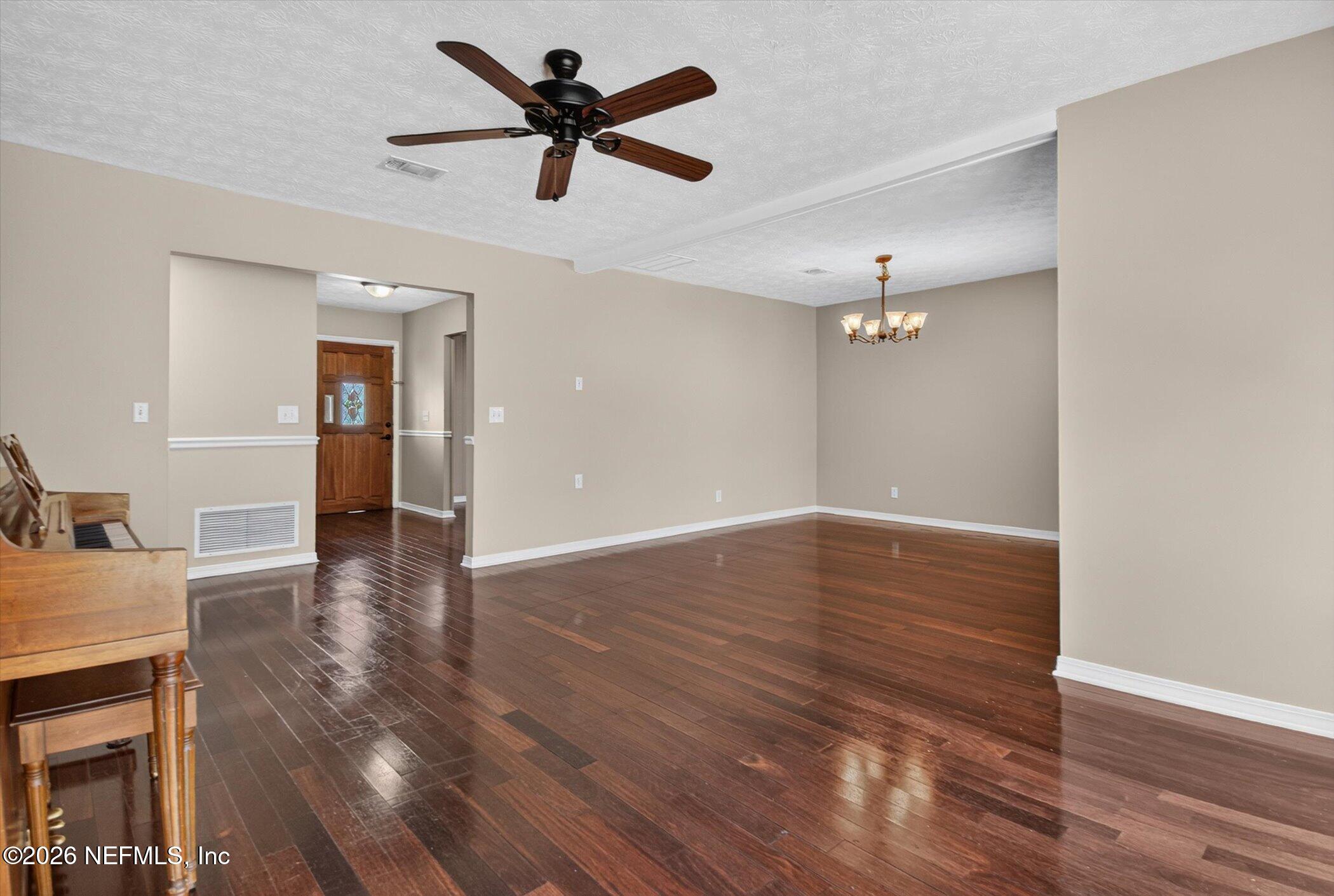 2705 Navajo Road Orange Park, FL 32073 - Photo 16 of 58 wooden floor in an empty room with a window