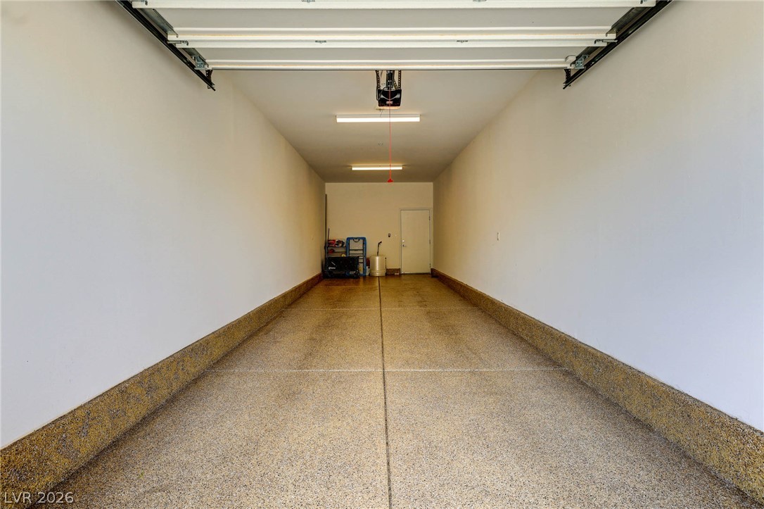 2555 Hampton Road, Unit 7203 Henderson, NV 89052 - Photo 31 of 46 Two-Car tandem garage features epoxy flooring. Door leads to first floor elevator lobby.