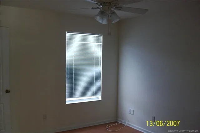 a bathroom with a granite countertop sink a toilet and bathtub