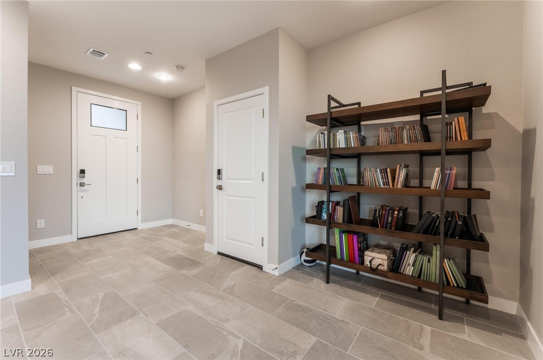 654 Amethyst Point Way Las Vegas, NV 89138 - Photo 15 of 50 Downstairs office has an alcove perfect for furniture/shelving