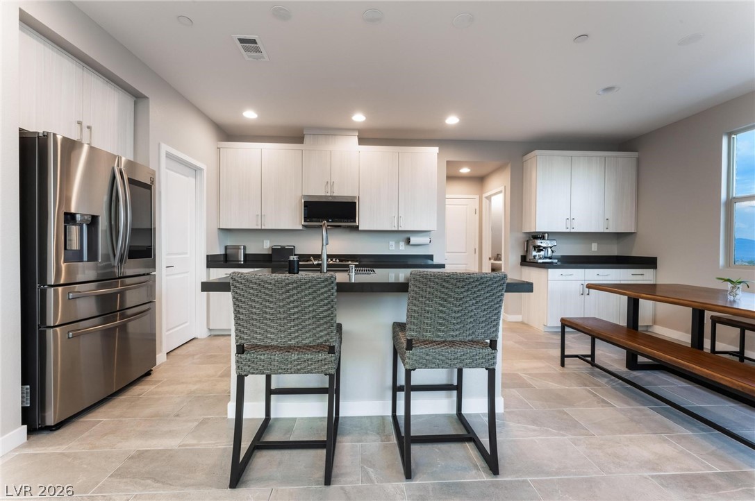 654 Amethyst Point Way Las Vegas, NV 89138 - Photo 17 of 50 2nd Level Kitchen/Dining
w/ Upgraded Cabinets, pullouts, self closing drawers & doors
