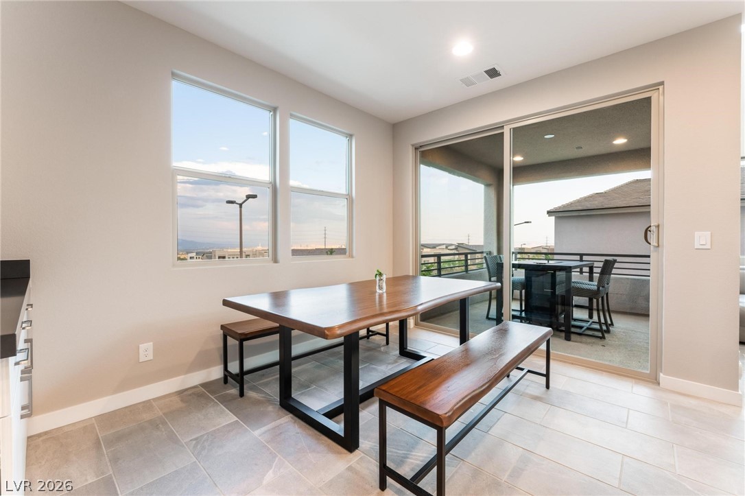 654 Amethyst Point Way Las Vegas, NV 89138 - Photo 21 of 50 Dining Room exits to Balcony #1 w/ Strip Views