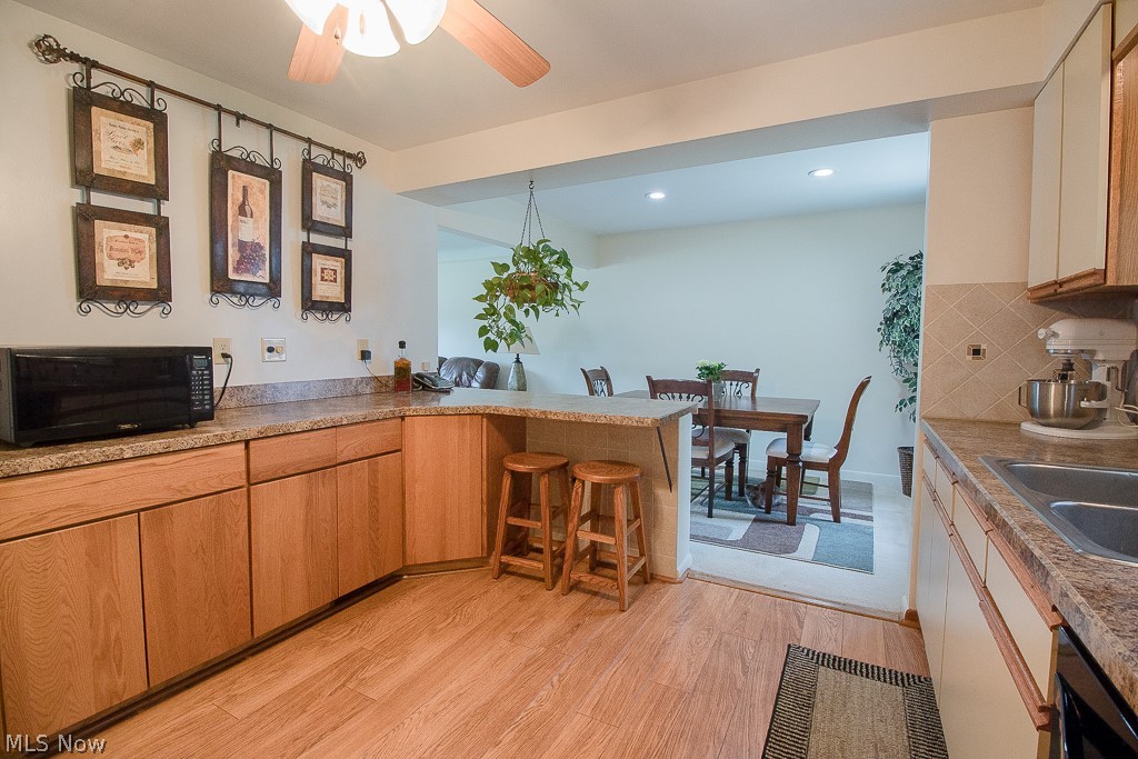30425 Vineyard Road Willowick, OH 44095 - Photo 4 of 22 Looking for a spacious kitchen? Look no further! This kitchen includes a breakfast peninsula and additional storage and counter space.