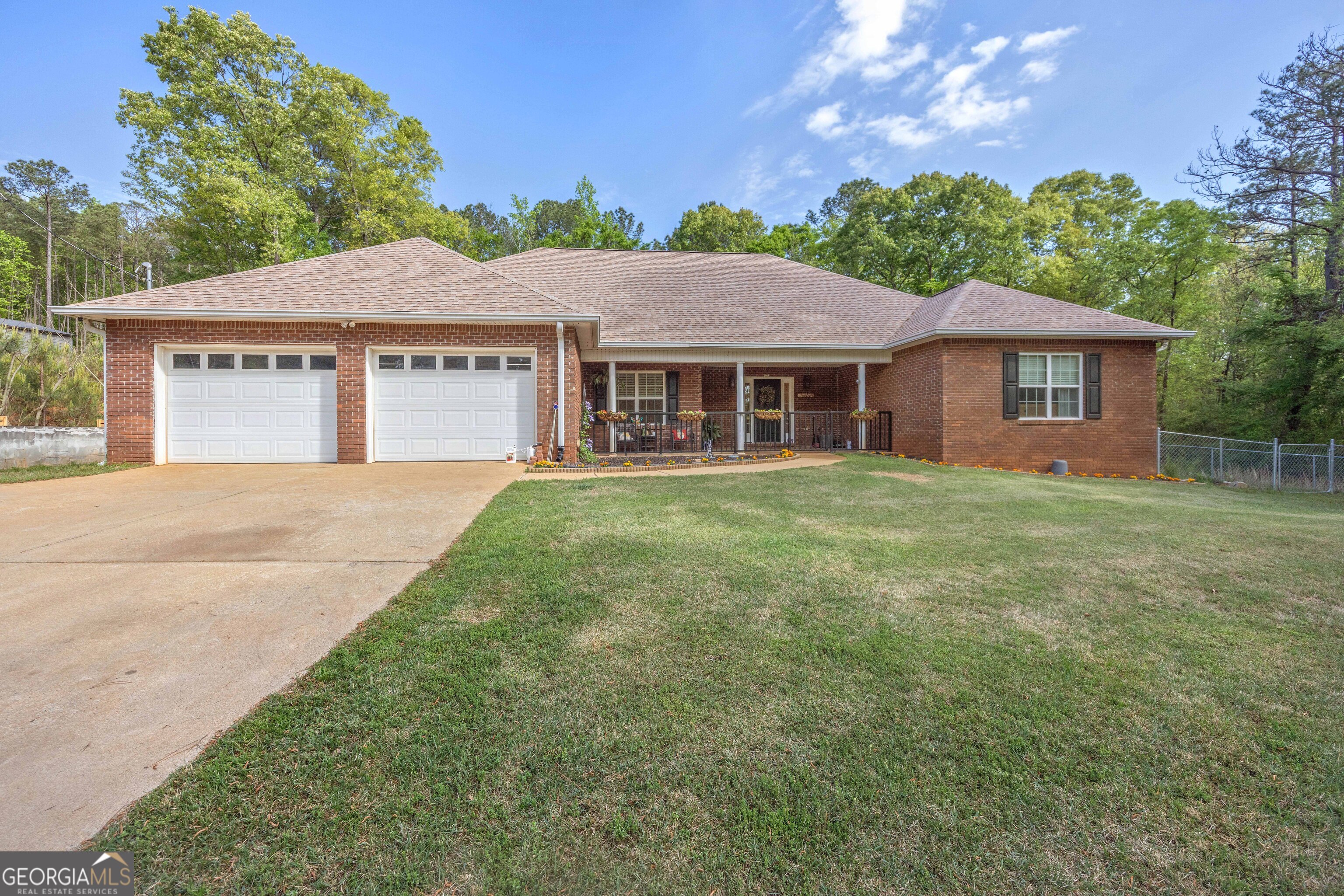 2083 Johnson Mill Road Hamilton, GA 31811 - Photo 1 of 30 a view of a yard in front of a house with large trees