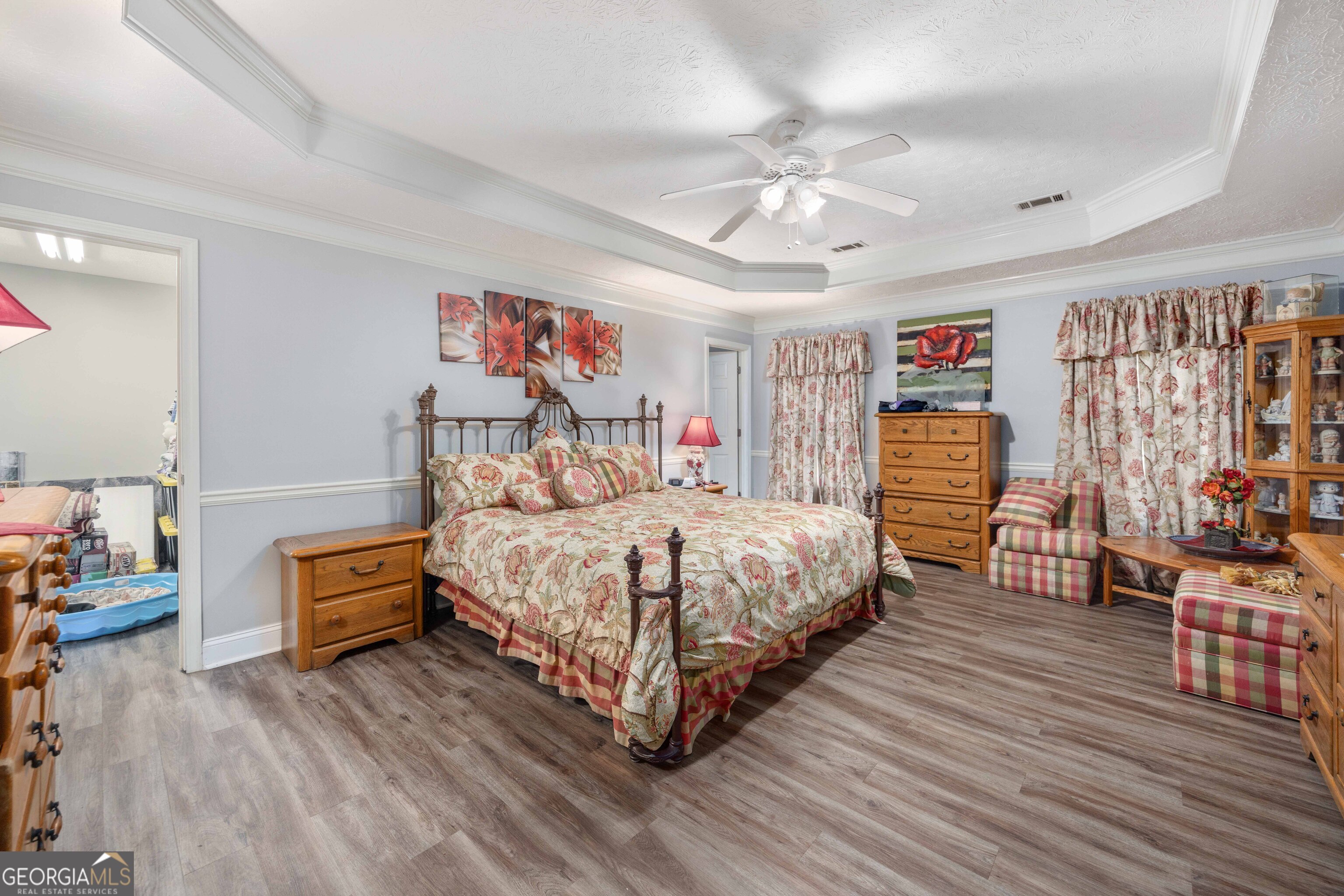 2083 Johnson Mill Road Hamilton, GA 31811 - Photo 11 of 30 a bedroom with a bed and wooden floor