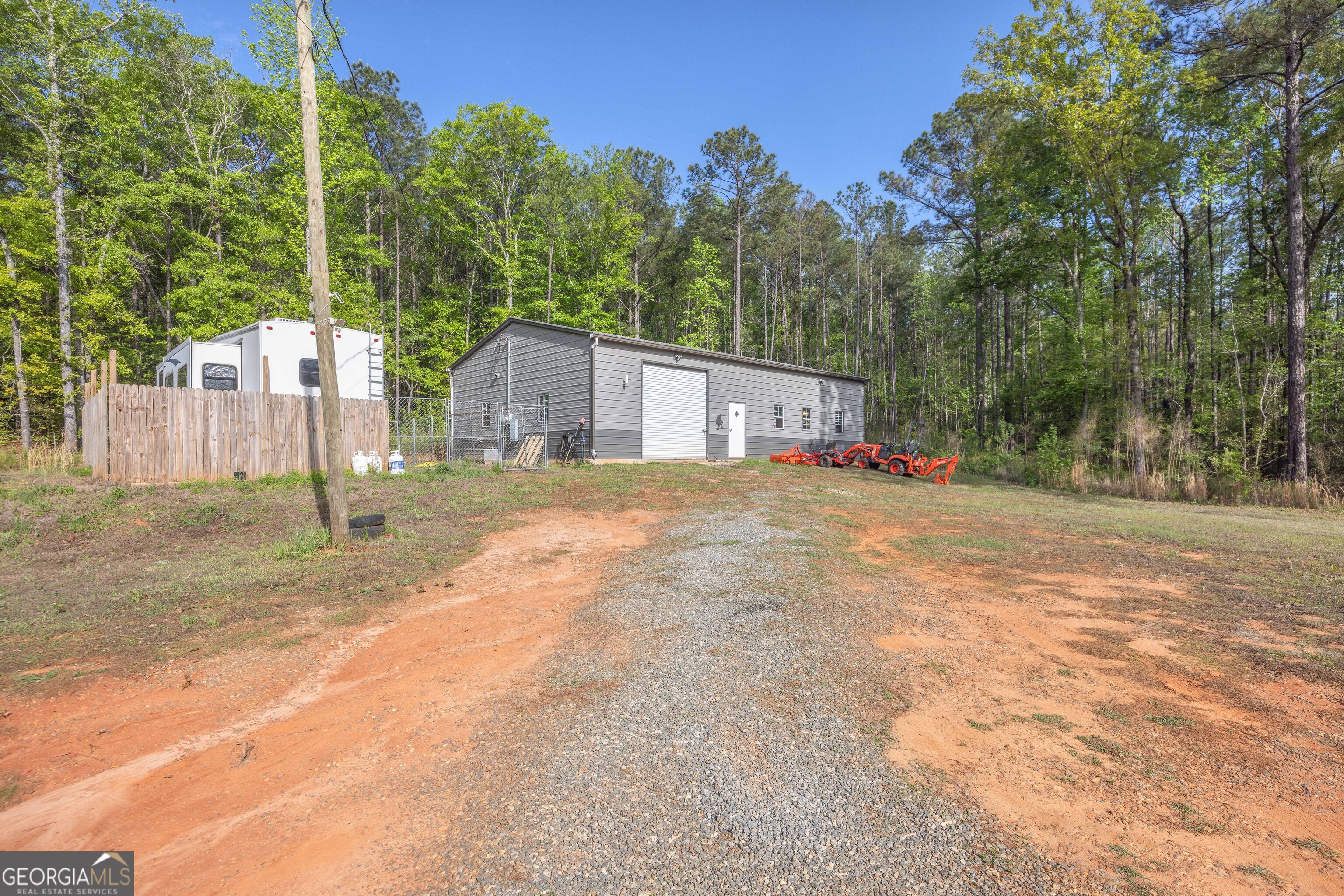 2083 Johnson Mill Road Hamilton, GA 31811 - Photo 26 of 30 a view of a house with backyard and trees