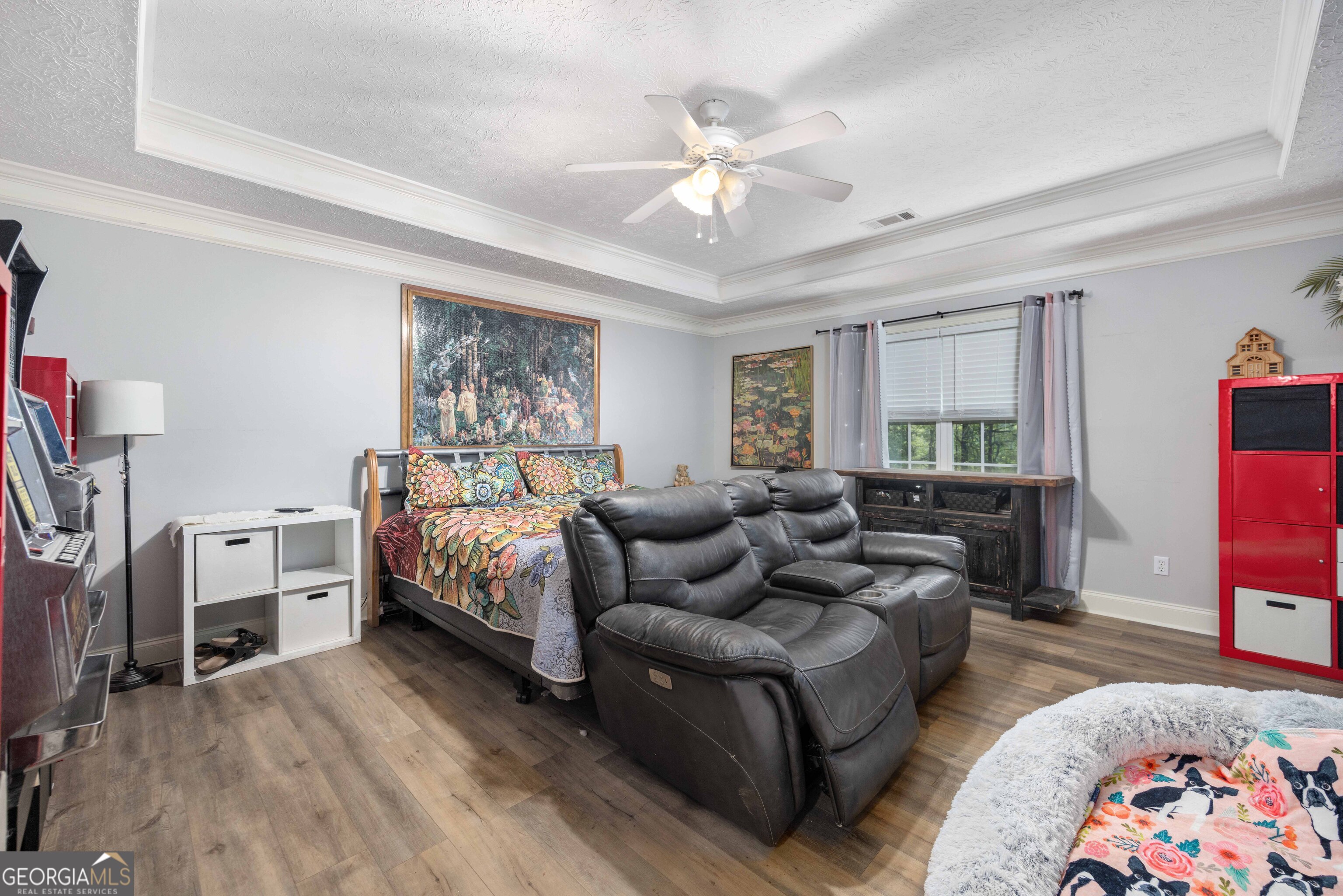 2083 Johnson Mill Road Hamilton, GA 31811 - Photo 5 of 30 a spacious bedroom with a bed couch and a window
