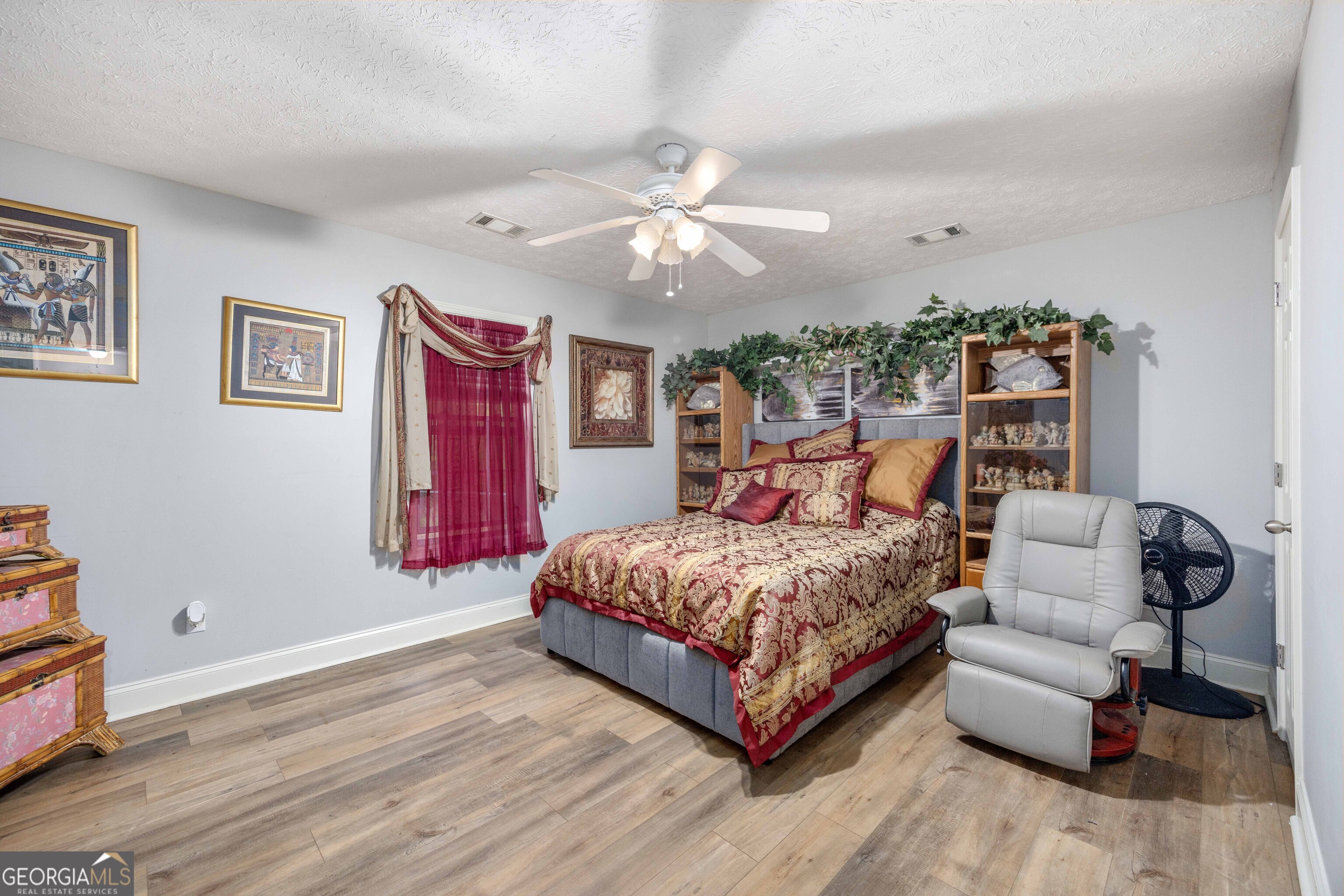 2083 Johnson Mill Road Hamilton, GA 31811 - Photo 7 of 30 a bedroom with a bed couch and window