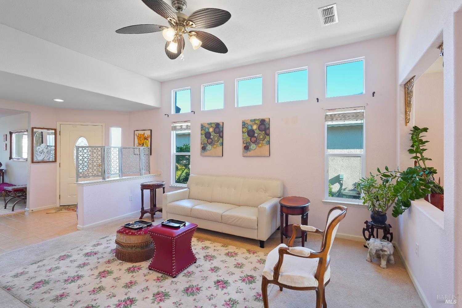 320 Spyglass Drive Rio Vista, CA 94571 - Photo 11 of 48 a living room with furniture and a potted plant