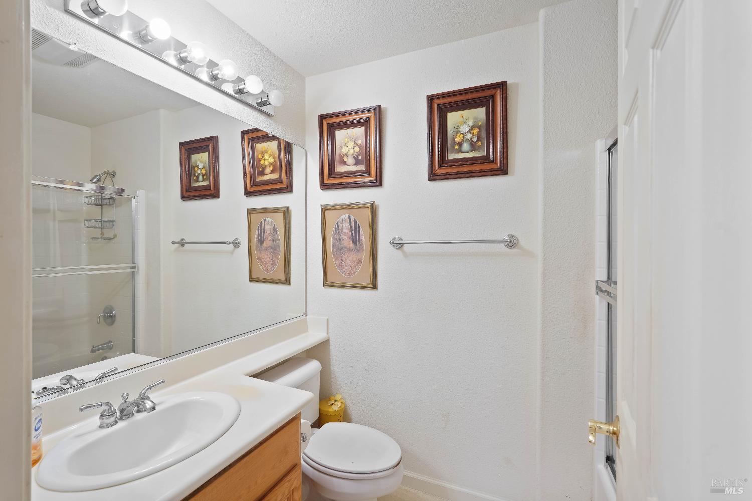 320 Spyglass Drive Rio Vista, CA 94571 - Photo 13 of 48 a bathroom with a toilet sink vanity granite and mirror