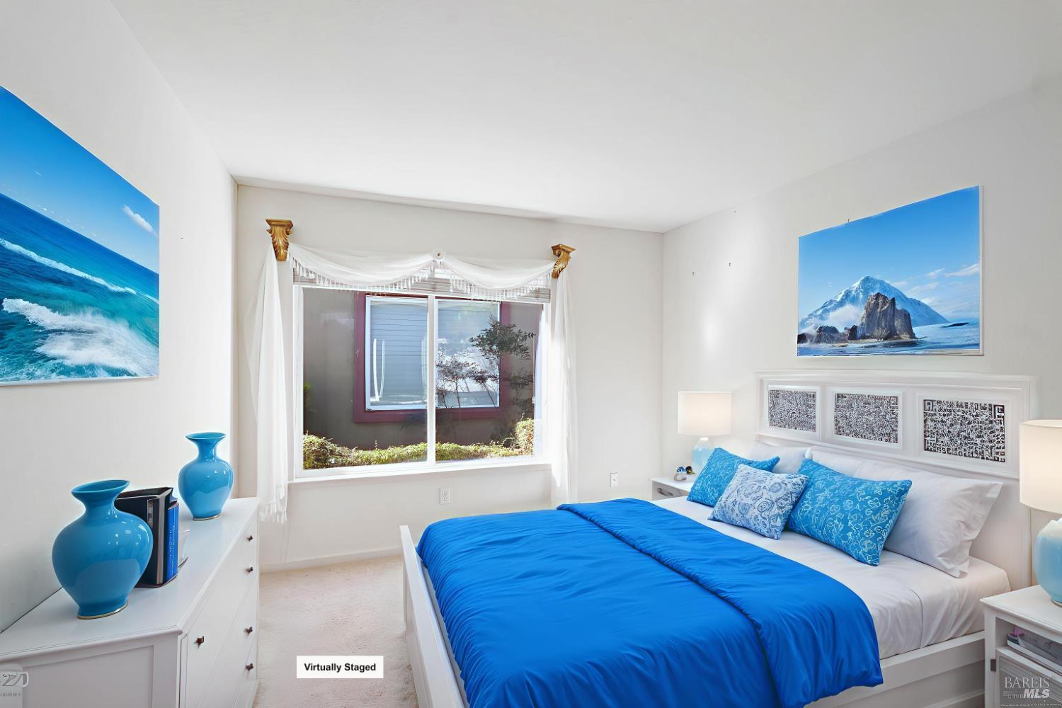 320 Spyglass Drive Rio Vista, CA 94571 - Photo 16 of 48 a bedroom with a bed and a painting on the wall