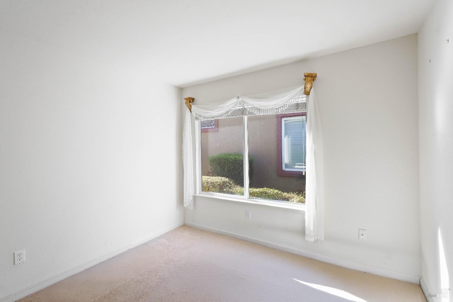 320 Spyglass Drive Rio Vista, CA 94571 - Photo 20 of 48 a view of an empty room with a window