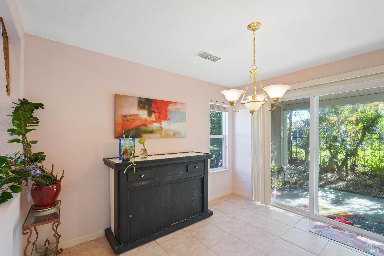 320 Spyglass Drive Rio Vista, CA 94571 - Photo 22 of 48 a kitchen that has a table and a chandelier