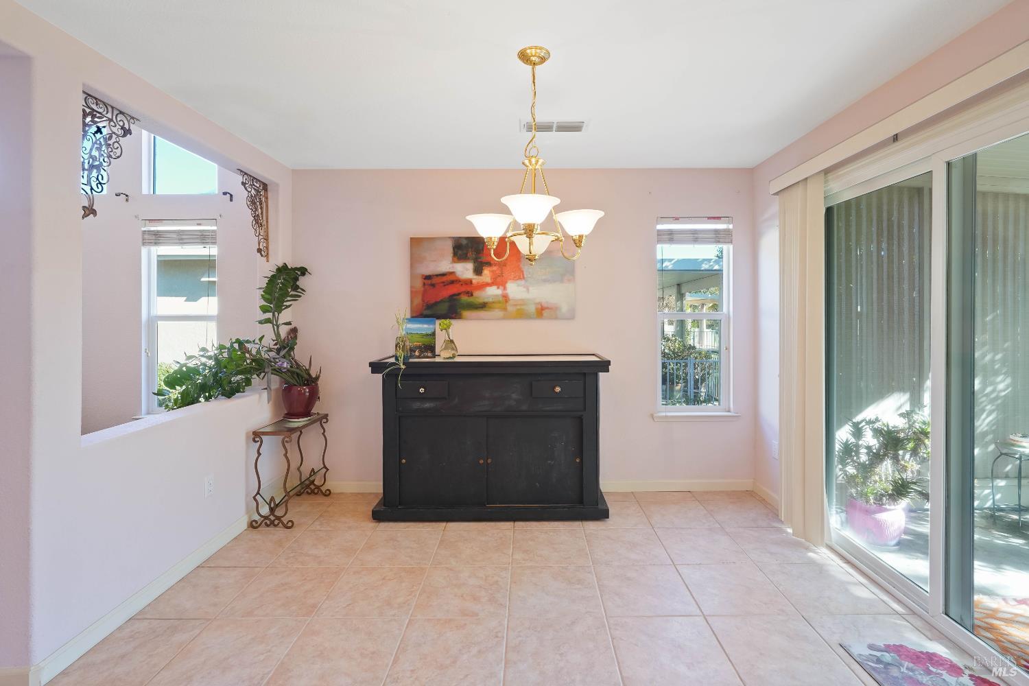 320 Spyglass Drive Rio Vista, CA 94571 - Photo 23 of 48 a living room with furniture and a chandelier