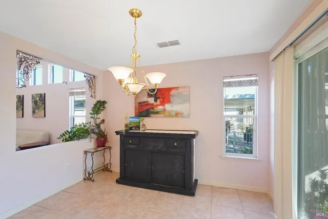 a view of a kitchen area and microwave