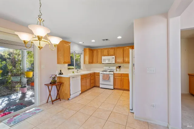 a kitchen with a sink a counter top space and appliances