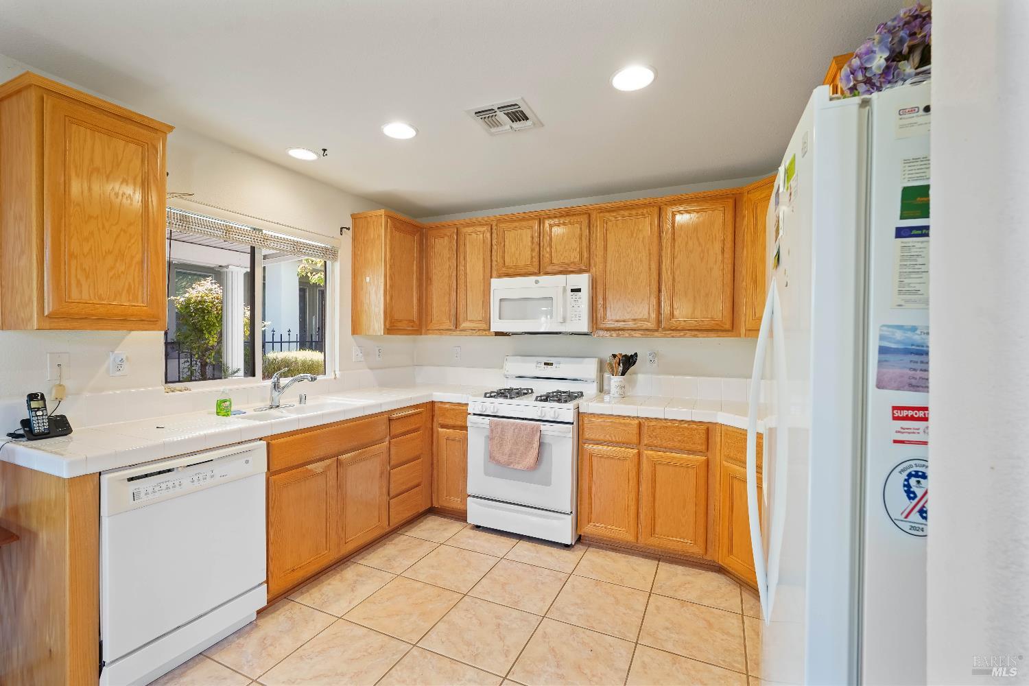 320 Spyglass Drive Rio Vista, CA 94571 - Photo 26 of 48 a kitchen with stainless steel appliances granite countertop a sink and cabinets