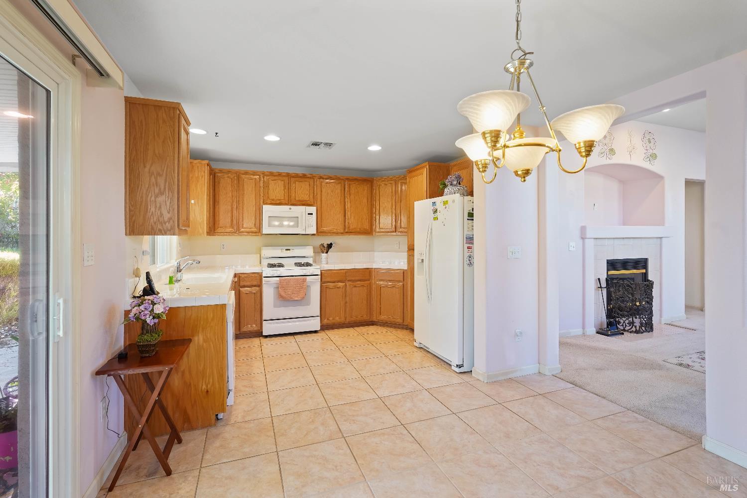 320 Spyglass Drive Rio Vista, CA 94571 - Photo 28 of 48 a kitchen with a refrigerator a center island a stove and a cabinets