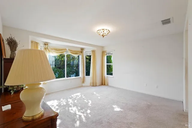 a view of workspace with furniture and window